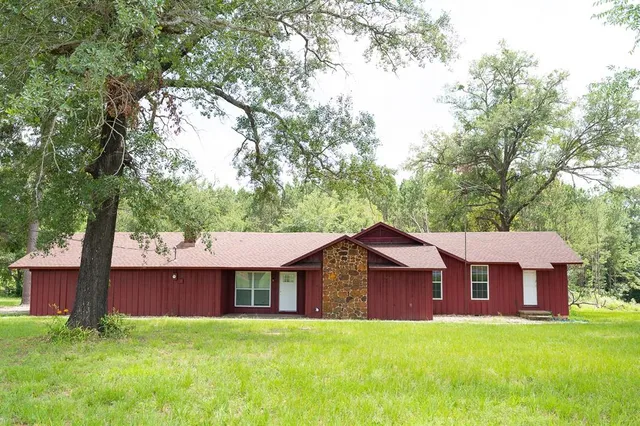 a front view of a house with yard