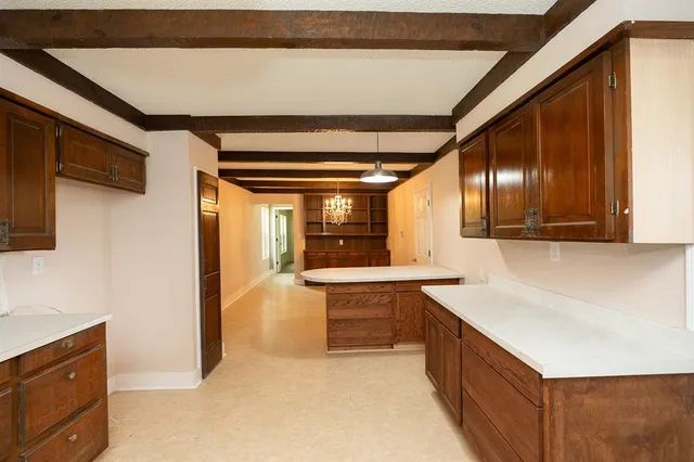 a view of kitchen with furniture and wooden floor