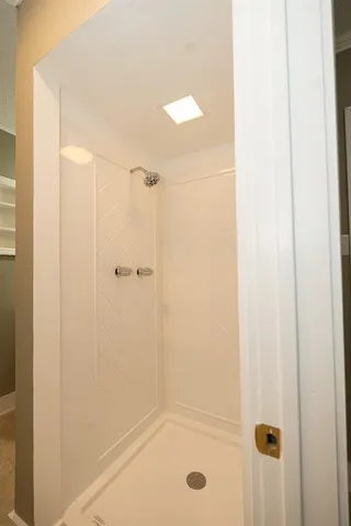 a white toilet sitting next to a bathroom sink