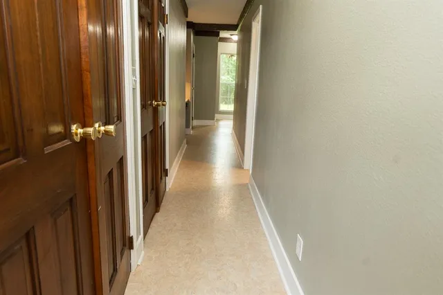 a view of house with a yard