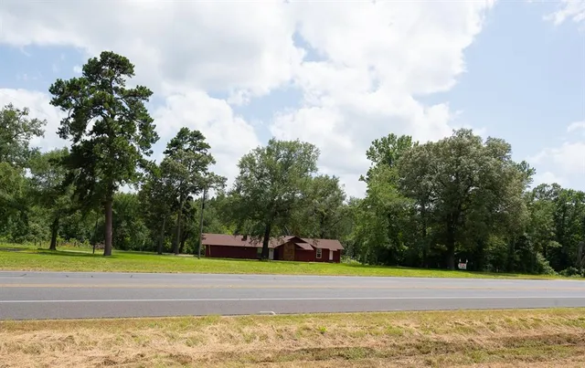 a view of a swimming pool and a yard