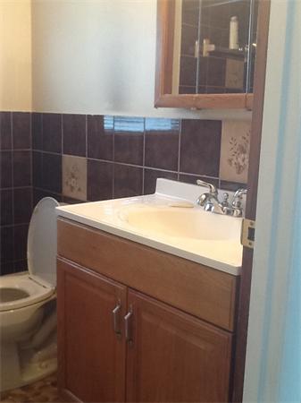 19 Barrows Road Reading, MA 01867 - Photo 13 of 21 a bathroom with a toilet and a sink