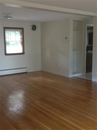19 Barrows Road Reading, MA 01867 - Photo 19 of 21 an empty room with wooden floor and windows
