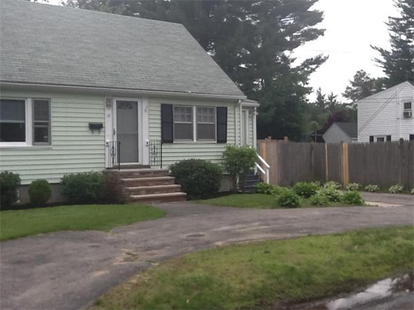 19 Barrows Road Reading, MA 01867 - Photo 3 of 21 a front view of a house with garden