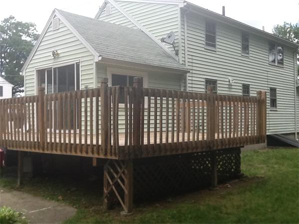 19 Barrows Road Reading, MA 01867 - Photo 4 of 21 a view of a house with a yard and deck