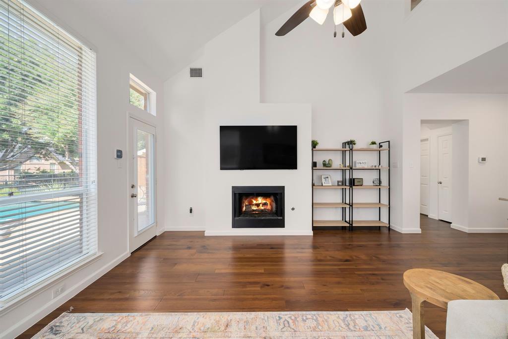 2524 Windgate Drive Frisco, TX 75033 - Photo 13 of 38 a living room with furniture and a fireplace