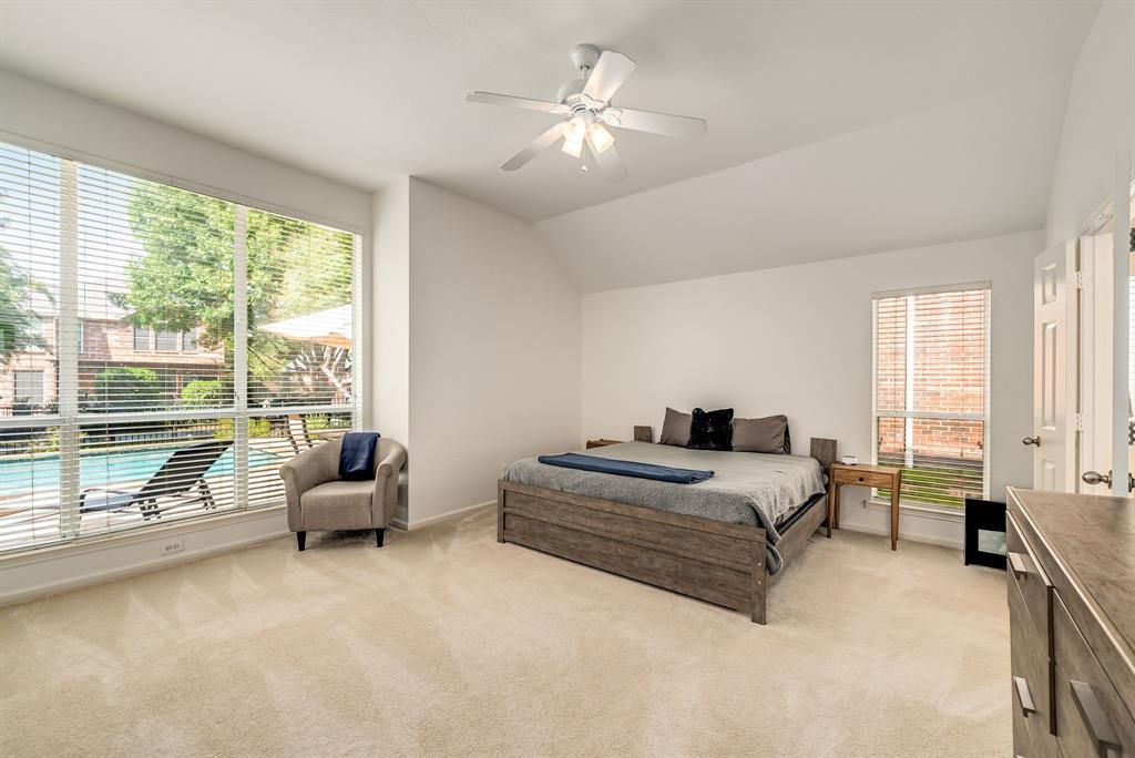 2524 Windgate Drive Frisco, TX 75033 - Photo 14 of 38 a spacious bedroom with a bed and a large window with balcony view