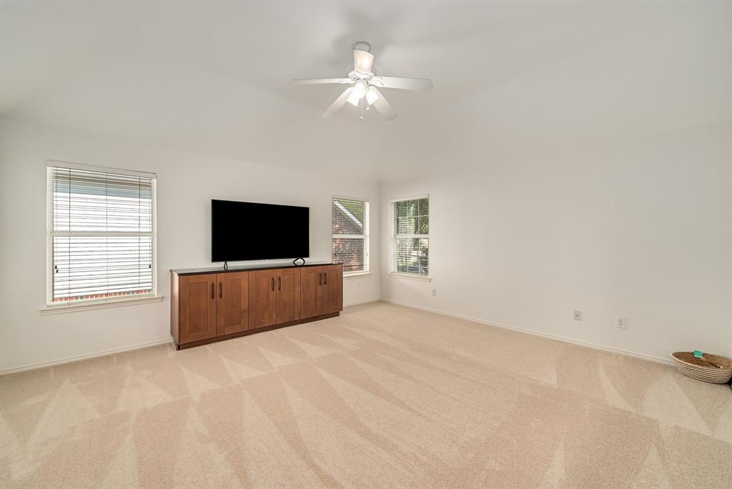 2524 Windgate Drive Frisco, TX 75033 - Photo 20 of 38 a living room with a flat screen tv and a window