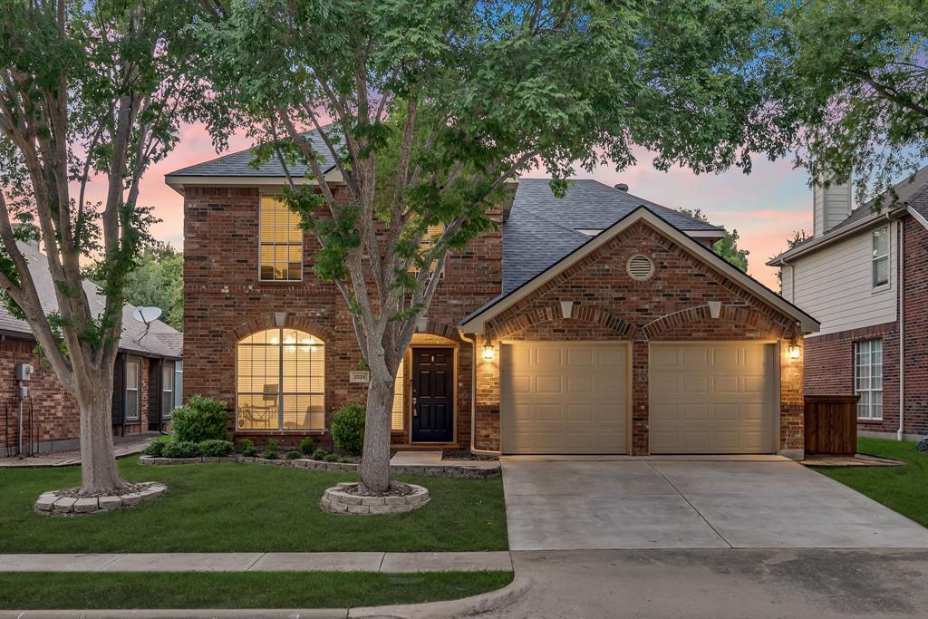 2524 Windgate Drive Frisco, TX 75033 - Photo 2 of 38 front view of a house with a yard