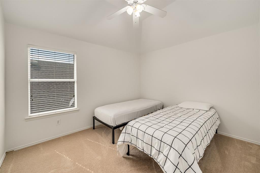 2524 Windgate Drive Frisco, TX 75033 - Photo 22 of 38 a bedroom with two beds and a table