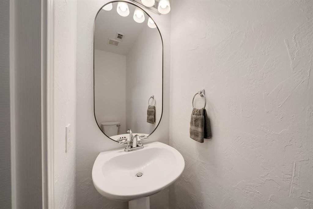 2524 Windgate Drive Frisco, TX 75033 - Photo 24 of 38 a bathroom with a sink and mirror