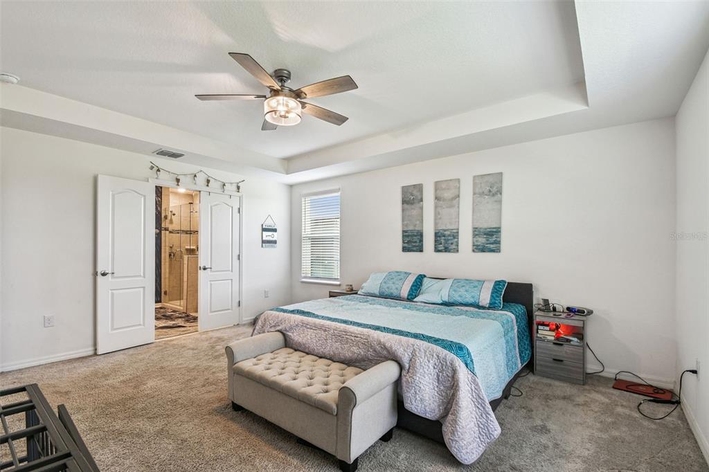 8207 Abalone Loop Palmetto, FL 34221 - Photo 11 of 37 a bedroom with a bed and window