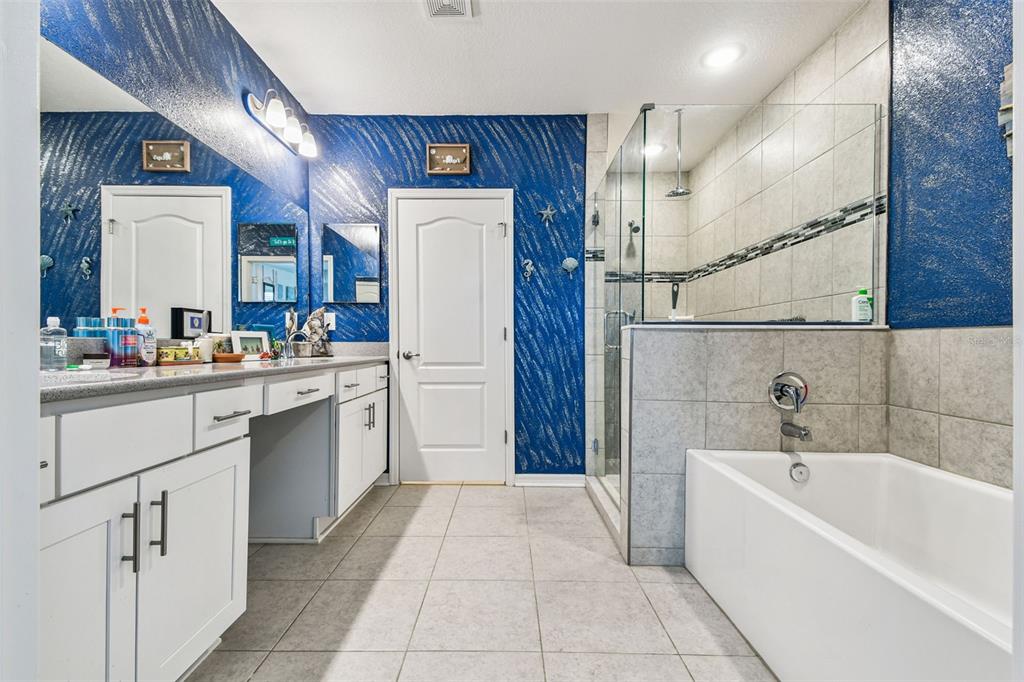 8207 Abalone Loop Palmetto, FL 34221 - Photo 14 of 37 a kitchen with a sink a refrigerator and cabinets