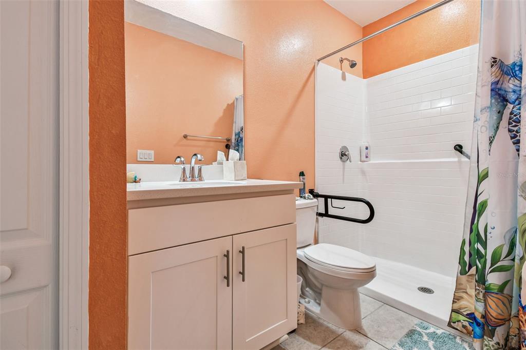 8207 Abalone Loop Palmetto, FL 34221 - Photo 20 of 37 a bathroom with a sink a toilet and a mirror