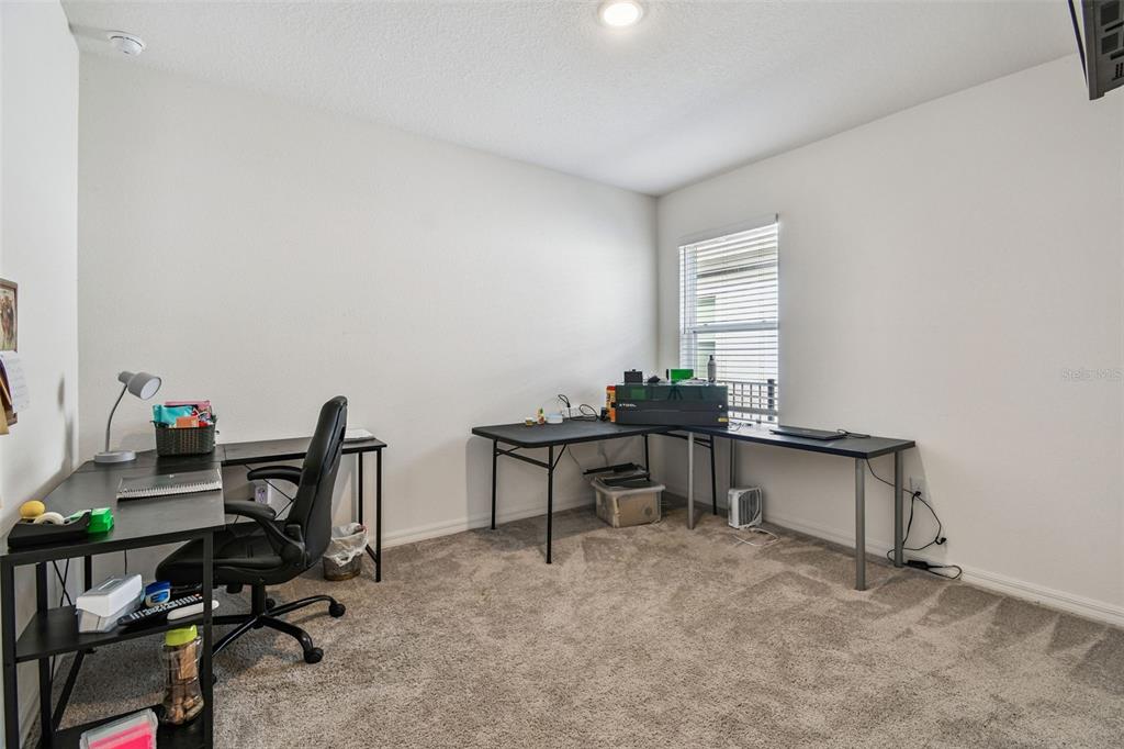 8207 Abalone Loop Palmetto, FL 34221 - Photo 22 of 37 a view of a workspace with furniture