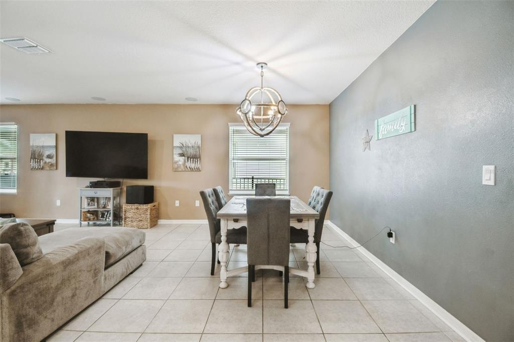 8207 Abalone Loop Palmetto, FL 34221 - Photo 24 of 37 a view of a livingroom with furniture window and wooden floor