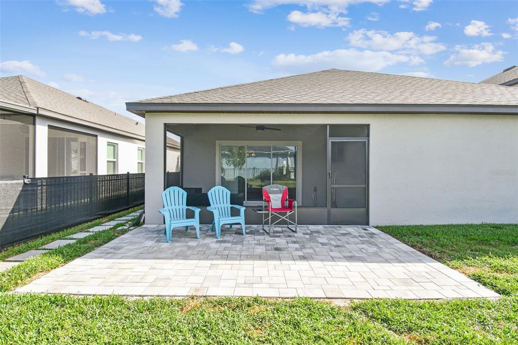 8207 Abalone Loop Palmetto, FL 34221 - Photo 28 of 37 a view of house with backyard outdoor seating area