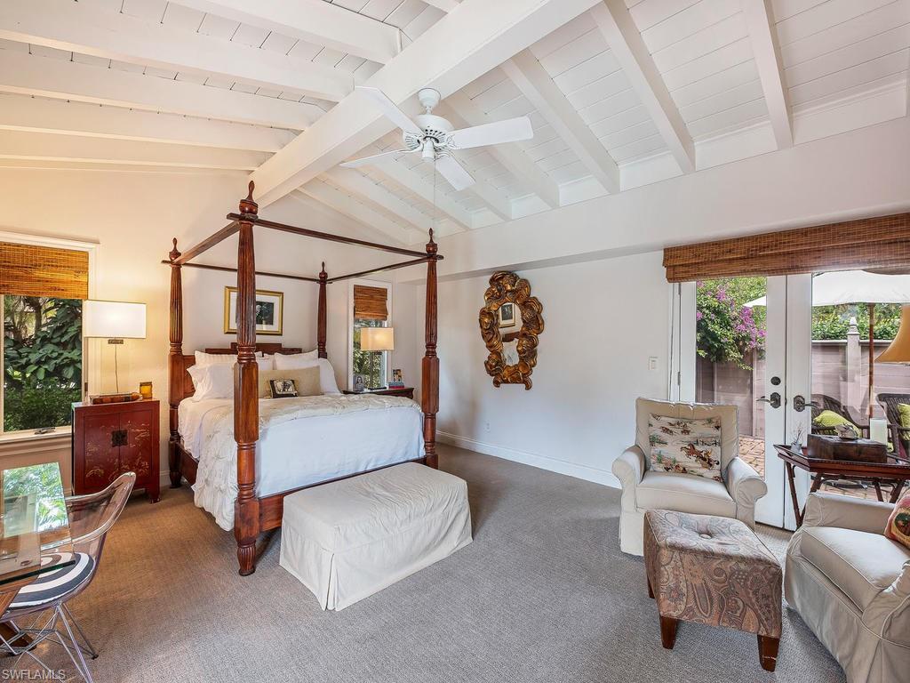 1673 Mandarin Road Naples, FL 34102 - Photo 9 of 16 a living room with furniture and a large window