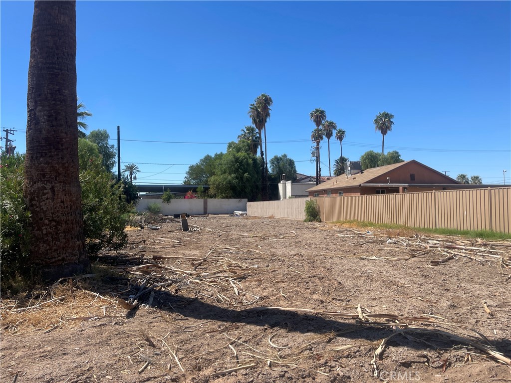 0 South Broadway Blythe, CA 92225 - Photo 3 of 6 a view of a large space in front of a house with wooden fence