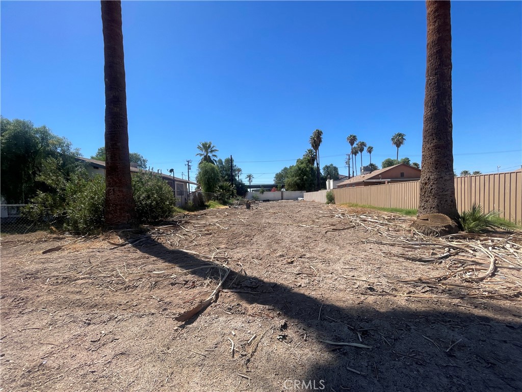0 South Broadway Blythe, CA 92225 - Photo 4 of 6 a view of a dry yard with wooden fence