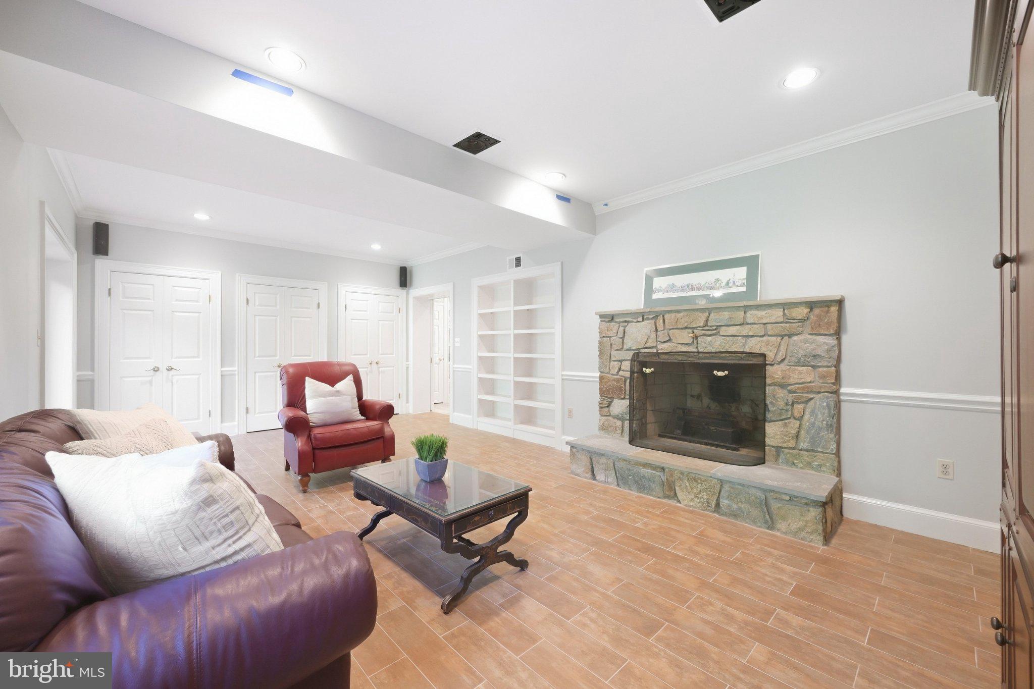 10804 Lockland Road Potomac, MD 20854 - Photo 41 of 47 Lower Level Media Room with Wood Burning Fireplace