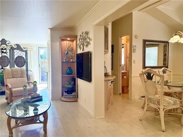 a view of a bedroom with a window and chair