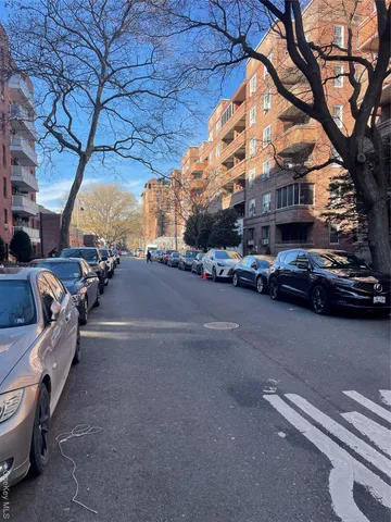 a view of a street with cars