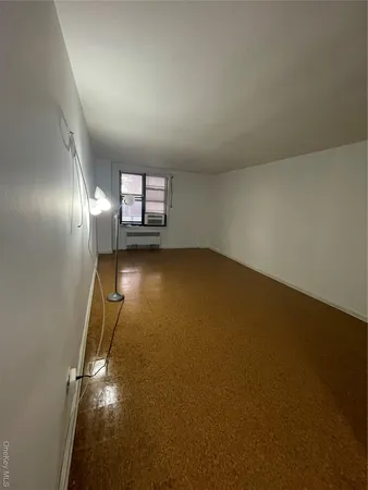 an empty room with a empty space and window