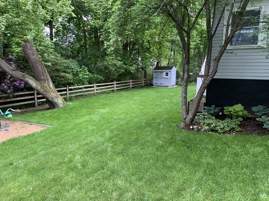 27 Brookfield Road Wellesley, MA 02481 - Photo 29 of 33 a view of a backyard with a garden