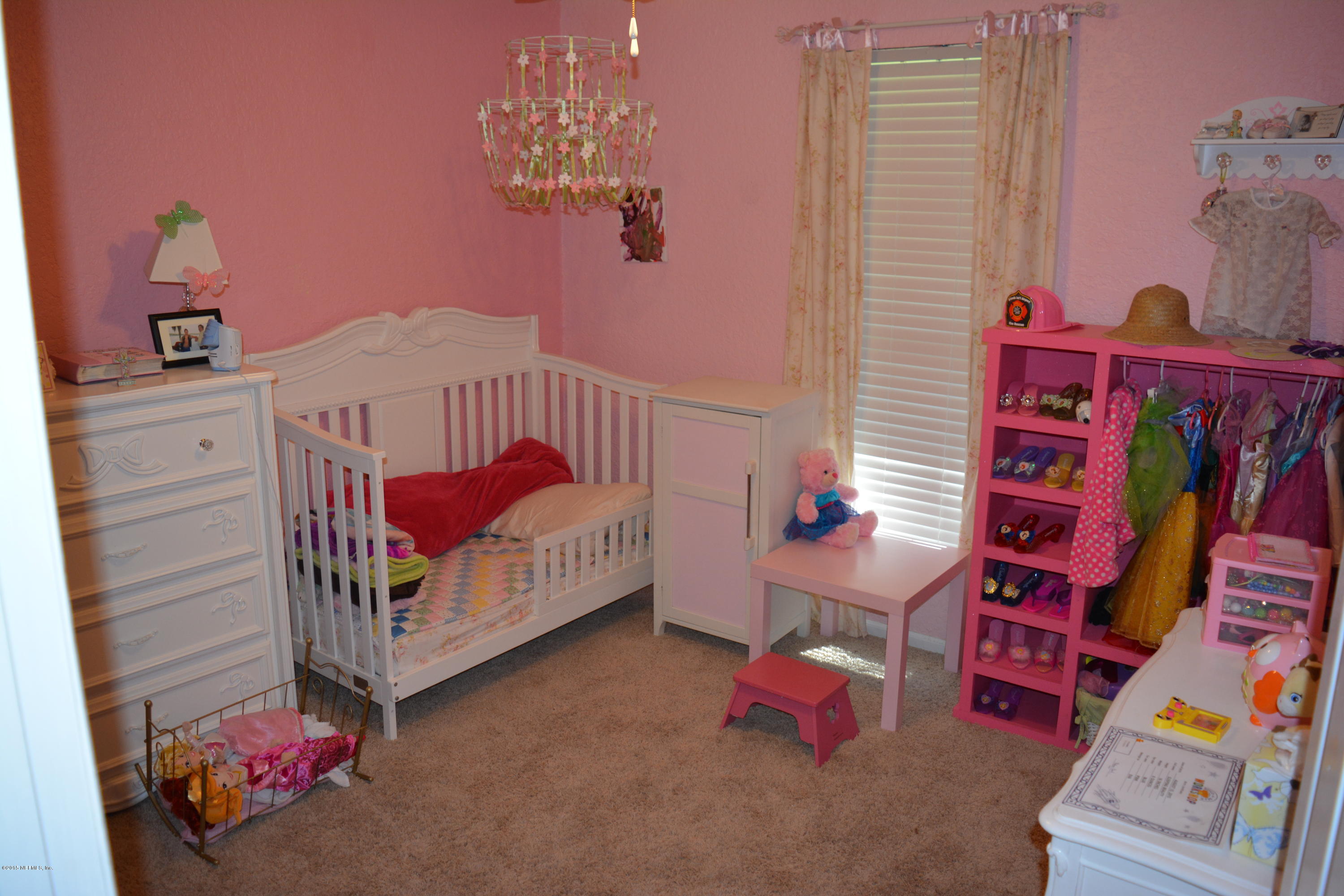4264 Cedar Road Orange Park, FL 32065 - Photo 29 of 41 a bedroom with furniture and a baby crib