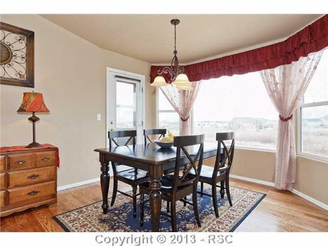 12009 Rio Secco Road Peyton, CO 80831 - Photo 11 of 24 Large eating nook off kitchen overlooks Pikes Peak view