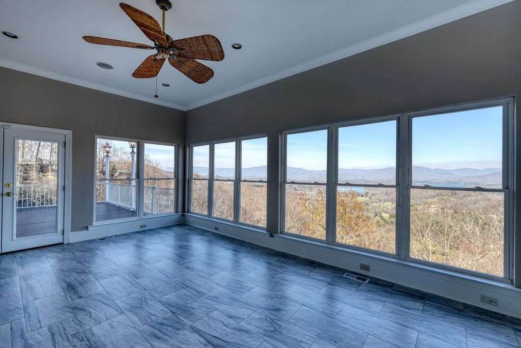1436 Harris Ridge Road Young Harris, GA 30582 - Photo 19 of 86 a view of an empty room with wooden floor and a window