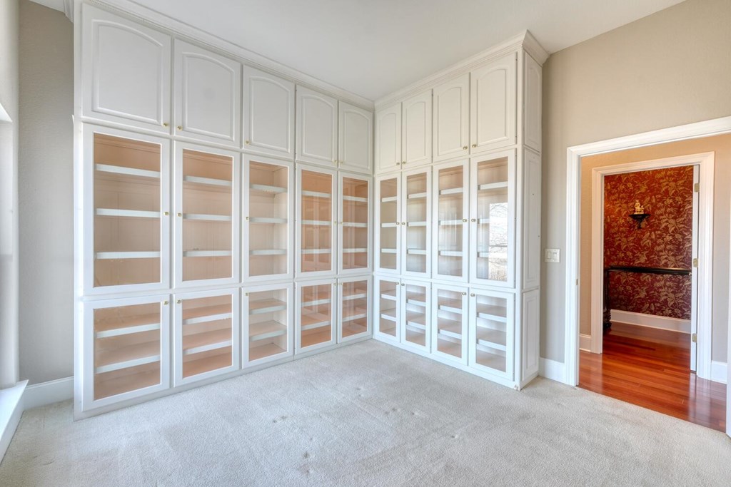 1436 Harris Ridge Road Young Harris, GA 30582 - Photo 29 of 86 a view of an empty room with a wooden floor and windows