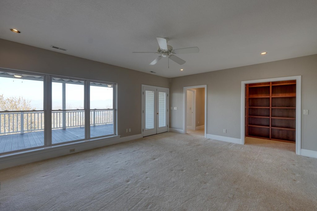1436 Harris Ridge Road Young Harris, GA 30582 - Photo 47 of 86 a view of an empty room with a window and a kitchen