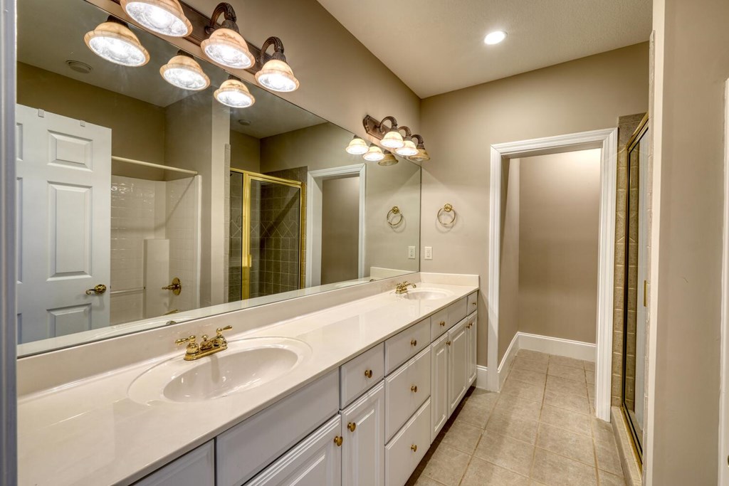1436 Harris Ridge Road Young Harris, GA 30582 - Photo 52 of 86 a bathroom with a double vanity sink and a mirror