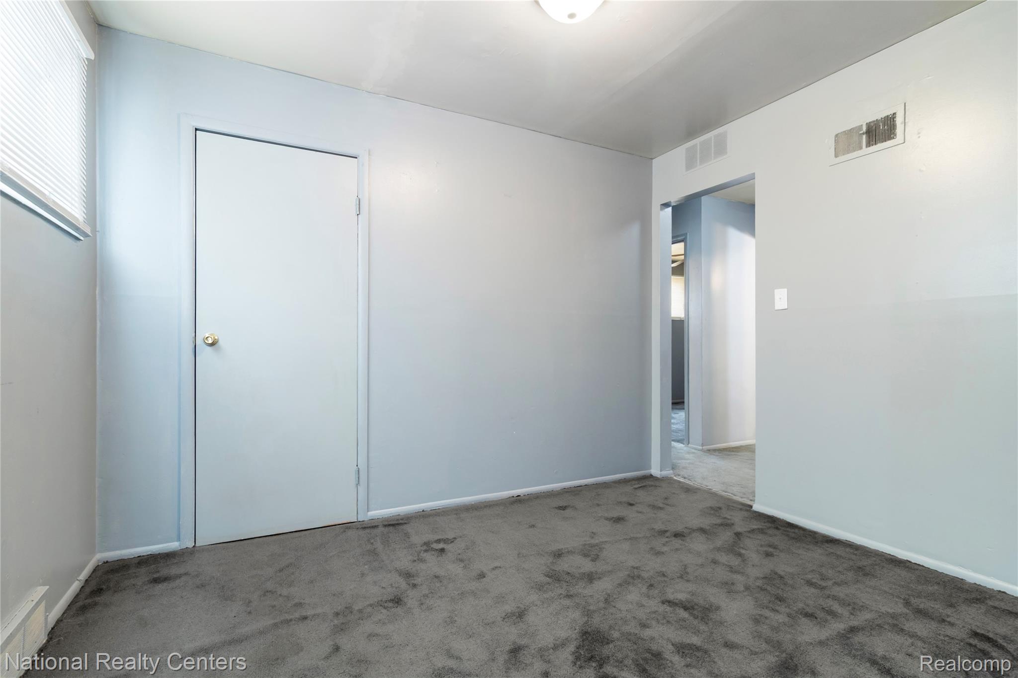 13525 Evergreen Road Detroit, MI 48223 - Photo 10 of 25 Empty room featuring carpet flooring and baseboards