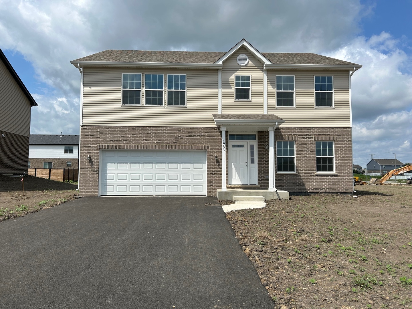 933 Willow Road Manteno, IL 60950 - Photo 1 of 20 a front view of a house with a yard and garage