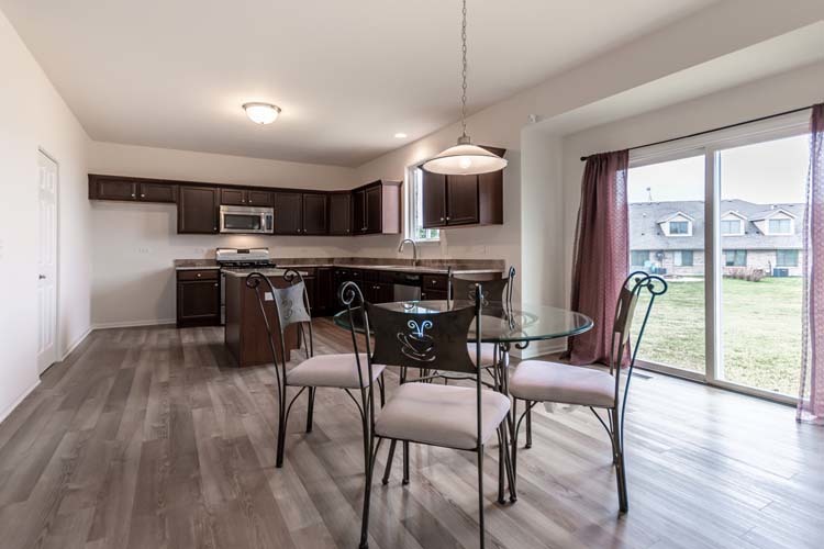 933 Willow Road Manteno, IL 60950 - Photo 5 of 20 a view of a dining room with furniture window and wooden floor
