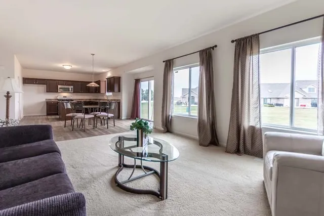 a living room with furniture and a table