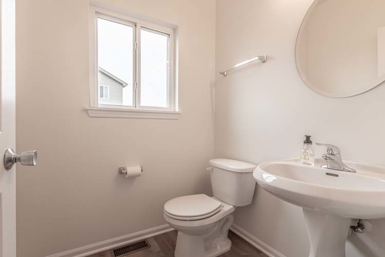 933 Willow Road Manteno, IL 60950 - Photo 8 of 20 a bathroom with a sink toilet and a mirror