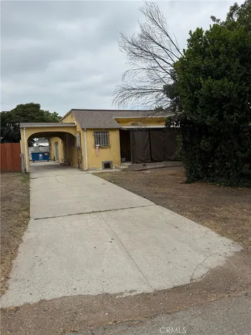a house with a tree in front of it