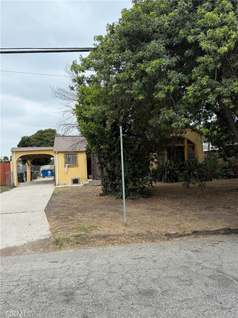 471 West Bennett Street Compton, CA 90220 - Photo 2 of 20 a house with a tree in front of it