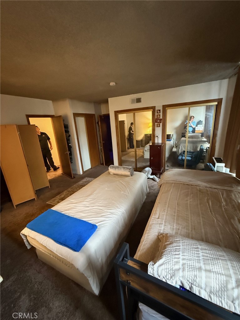 471 West Bennett Street Compton, CA 90220 - Photo 5 of 20 a bed room with furniture and a wooden floor