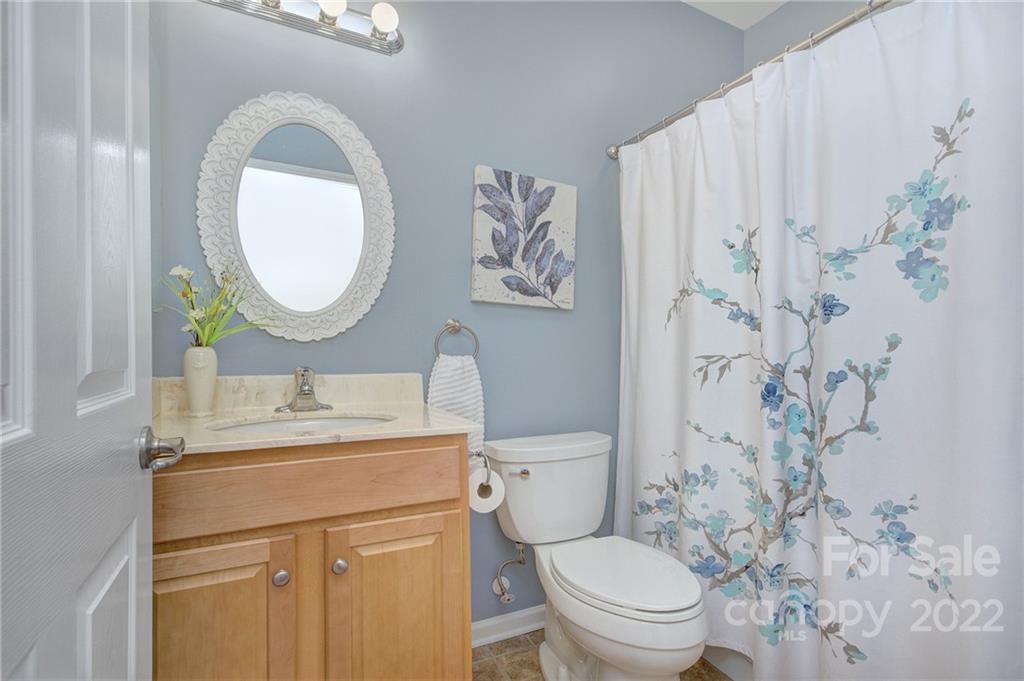 256 Garnet Court Fort Mill, SC 29708 - Photo 22 of 34 a bathroom with a toilet sink vanity and mirror