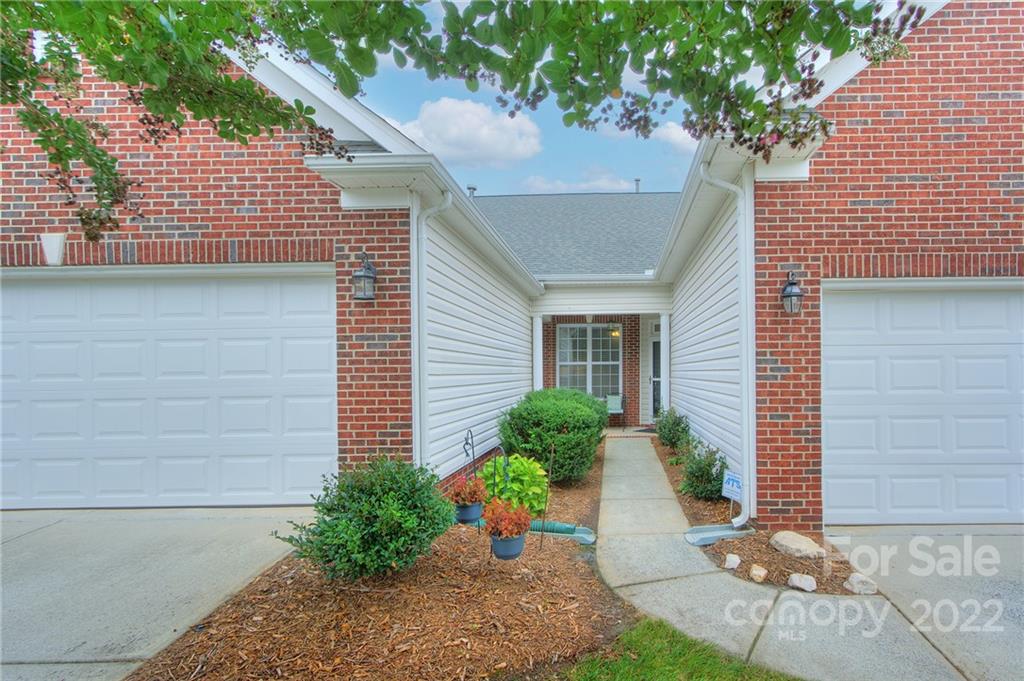 256 Garnet Court Fort Mill, SC 29708 - Photo 3 of 34 a front view of a house with a yard