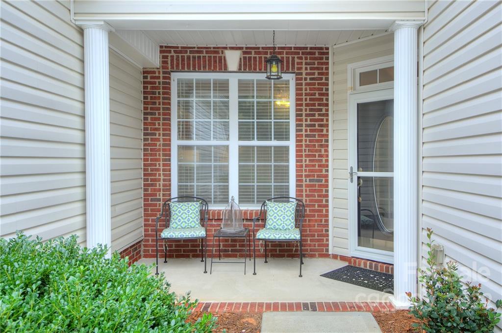 256 Garnet Court Fort Mill, SC 29708 - Photo 4 of 34 a bench sitting in front of a house