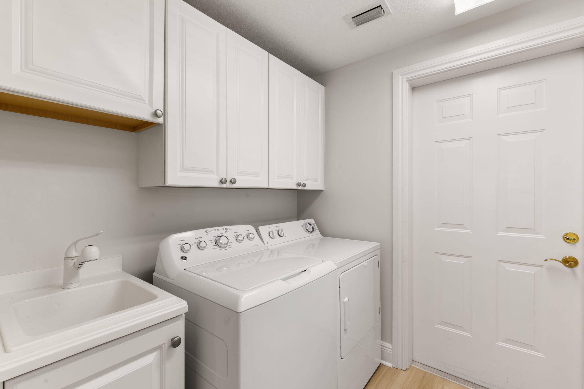 9213 Museo Circle, Unit 103 Naples, FL 34114 - Photo 26 of 47 a utility room with dryer and washer