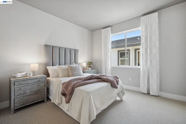 a bedroom with a bed and window