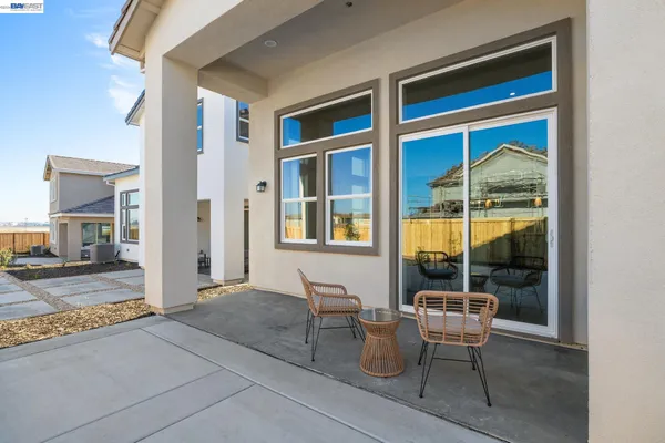 a outdoor space with a large window and couch