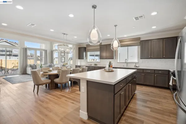 a kitchen with counter space sink appliances and cabinets